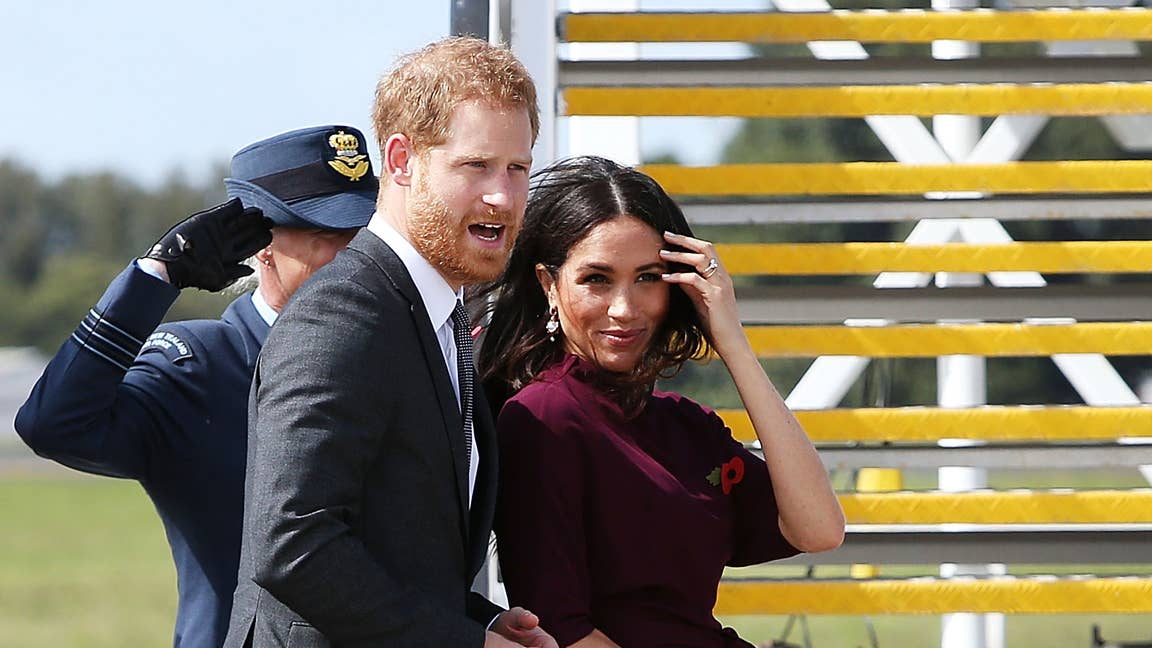 Meghan Markle Wore a Thing: Burgundy Hugo Boss Dress En Route to New Zealand Edition - Fashionista Meghan Markle Wore a Thing: Burgundy Hugo Boss Dress En Route to New Zealand Edition - Fashionista