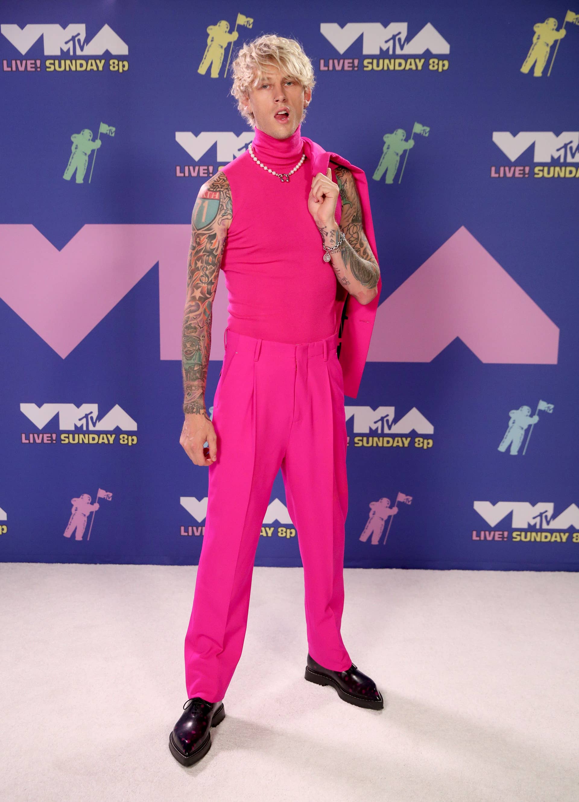 mgk dressed in pink I Have Been Telling Y'all We Need to Talk About Machine Gun Kelly's Style!