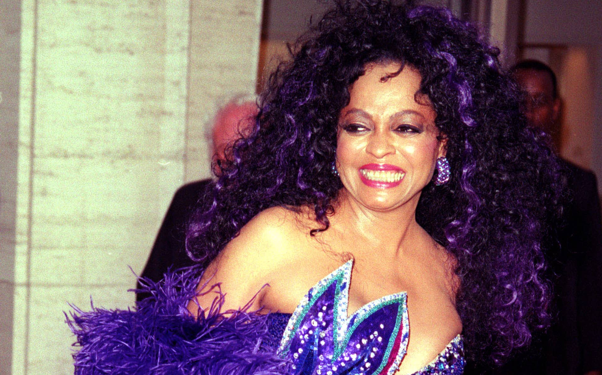 diana ross purple dress Diana Ross is a vision in a purple Bob Mackie dress. 1975. One of the  scenes in the movie Mahogany when she's being photographed by Tony  Perkins for a Revlon campaign. Her
