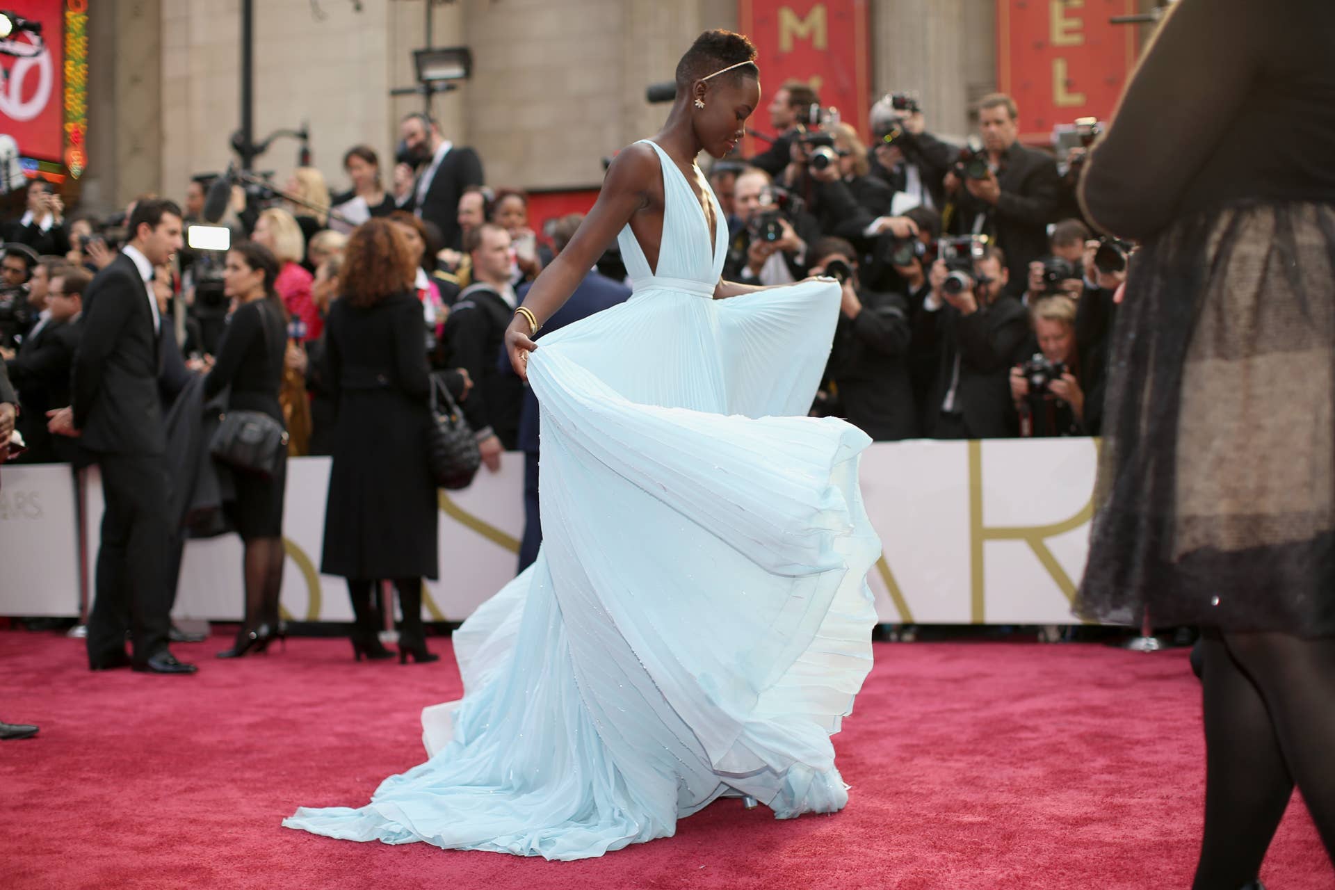 open lace back dress Lupita Nyongo 2024 Oscars Sequin Feather Red Carpet Dress