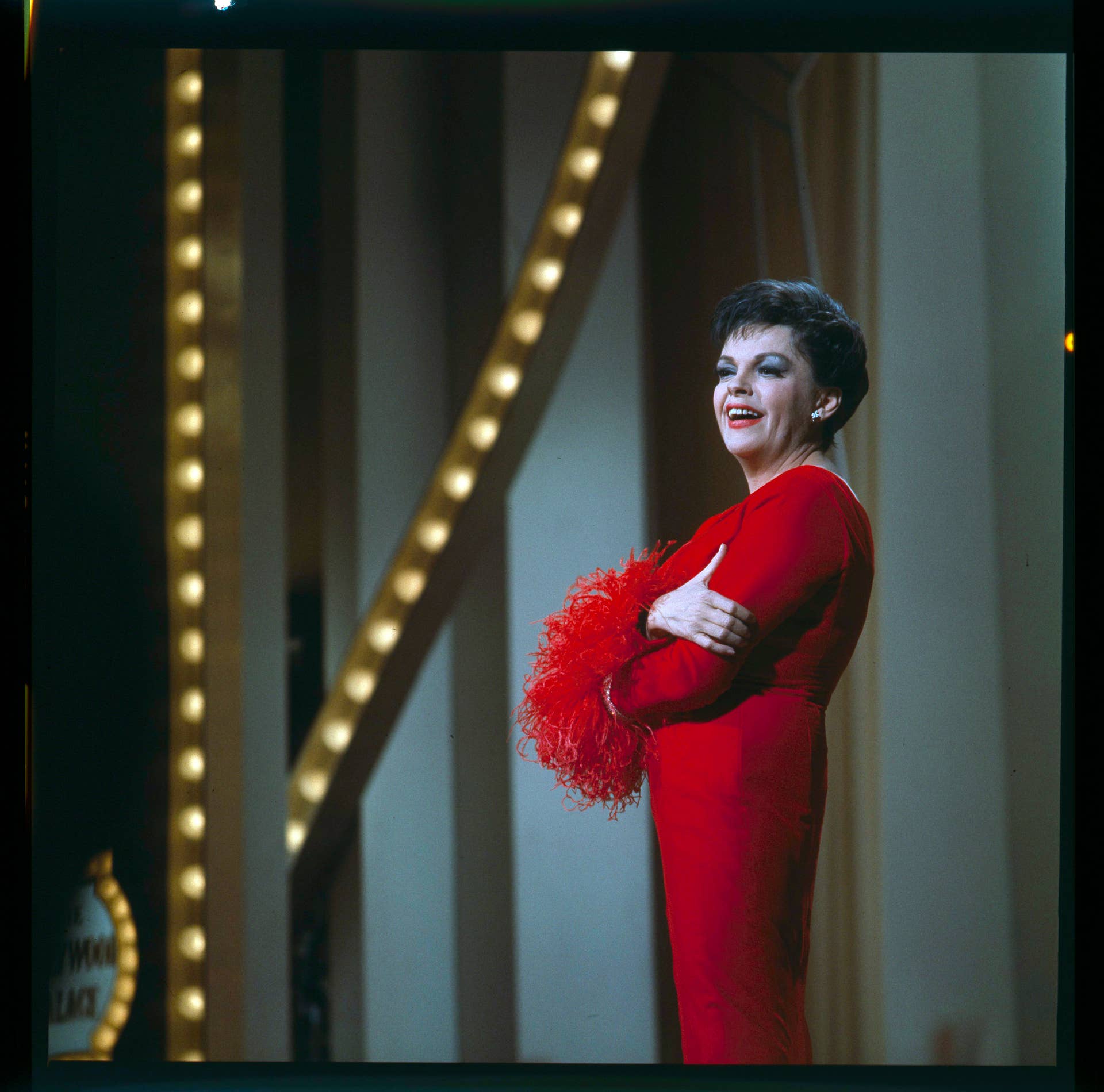 judy garland red dress Great Outfits in Fashion History: Judy Garland's 1965 Red Feathered Gown