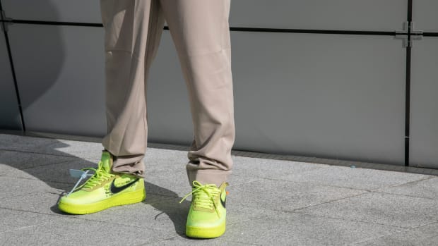 A guest is seen wearing yellow Nike sneakers during the Seoul Fashion Week 2020 S:S