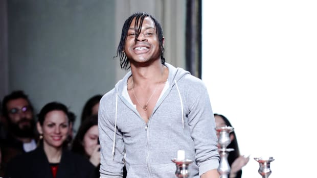 Telfar Clemens acknowledges the applause of the audience at Telfar fashion show during Pitti Immagine Uomo 97 2020