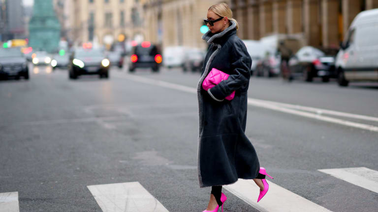 Celebrities like Rihanna and J.Lo are wearing big pink coats