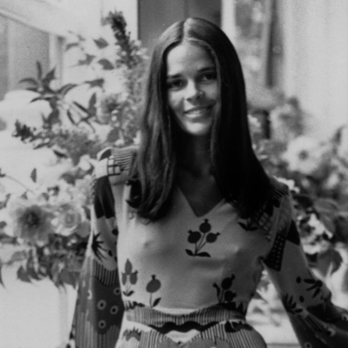 Great Outfits In Fashion History Ali Macgraw S Printed Ossie Clark Dress And White Boots Fashionista