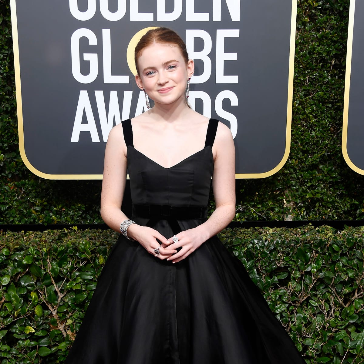 Great Outfits in Fashion History Sadie Sink in a Tea Length Miu Miu Dress Fashionista