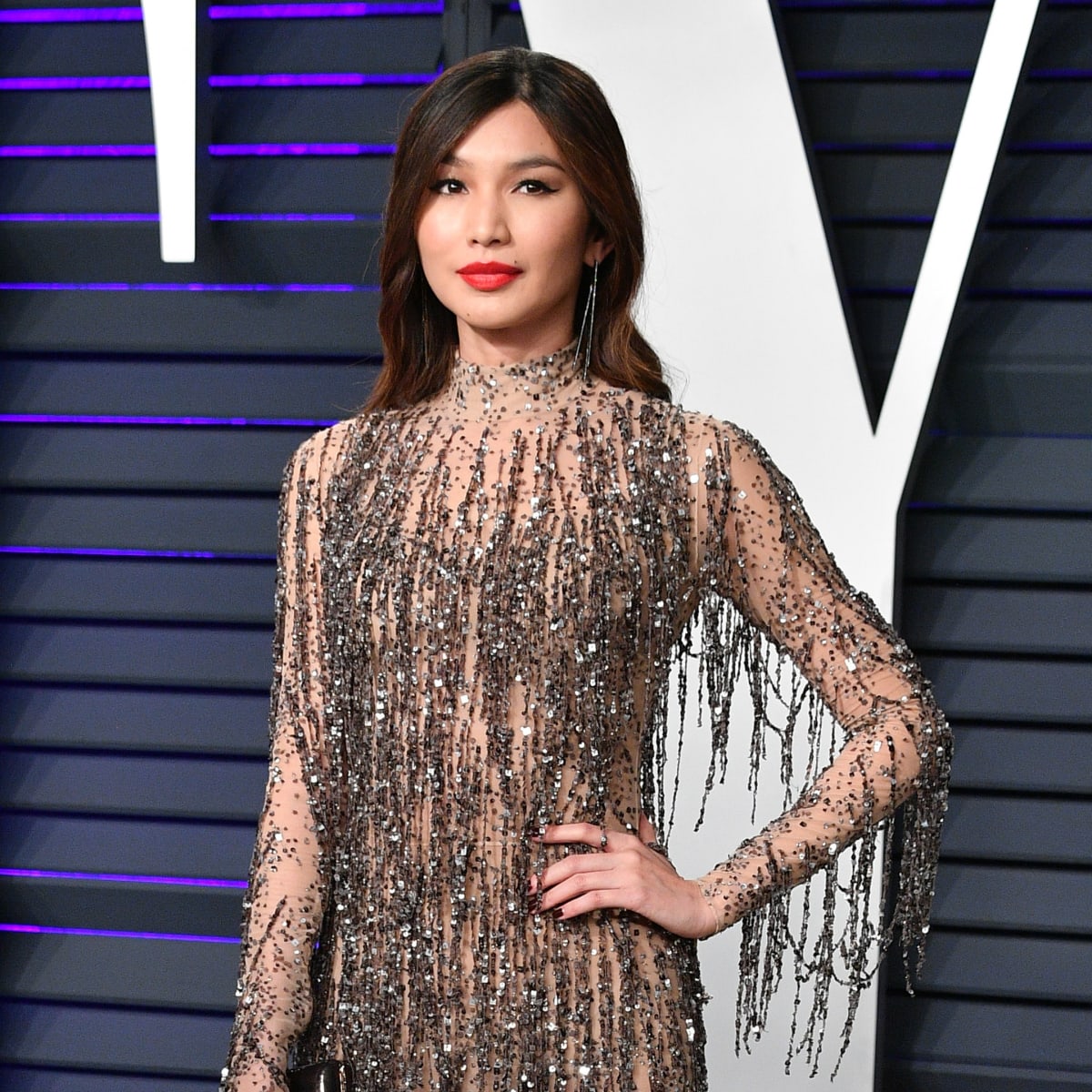 Great Outfits in Fashion History Gemma Chan Dripping Tom Ford Fringe Fashionista