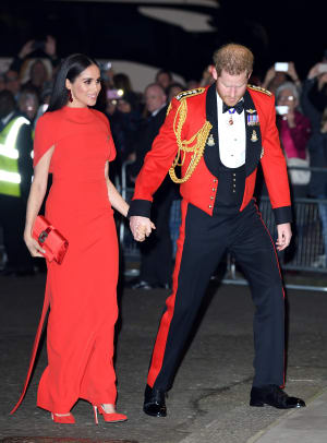 Meghan looks sombre in black Brandon Maxwell coat for Remembrance