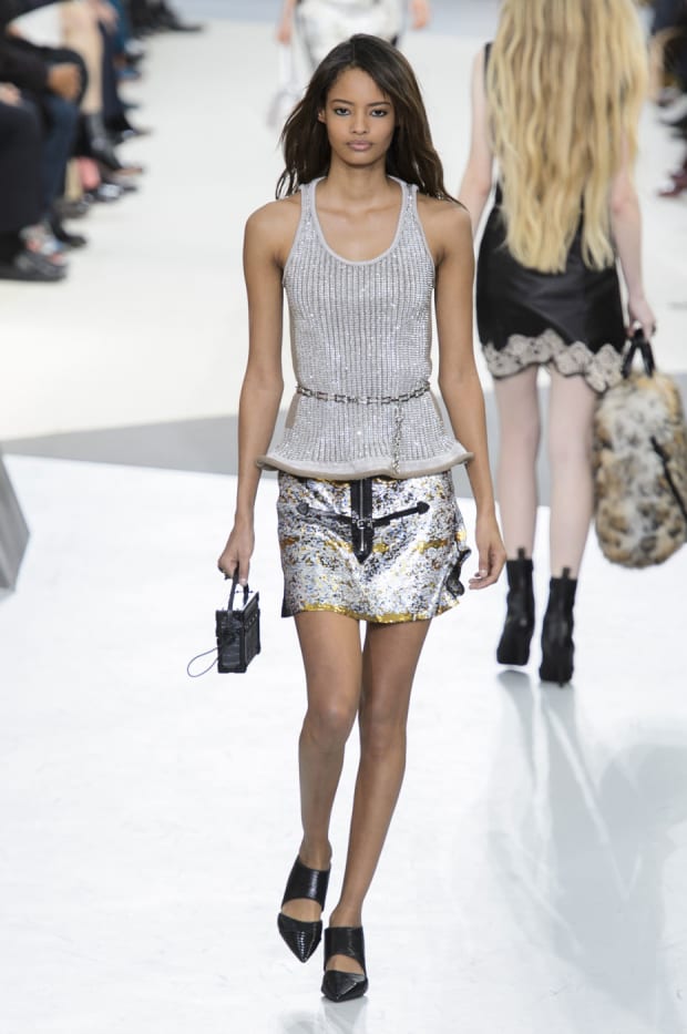 A model displays a creation by designer Nicolas Ghesquiere for Louis Vuitton  Fall-Winter 2014/2015 Ready-To-Wear collection show held at Cour Carree du  Louvre in Paris, France, on March 05, 2014. Photo by