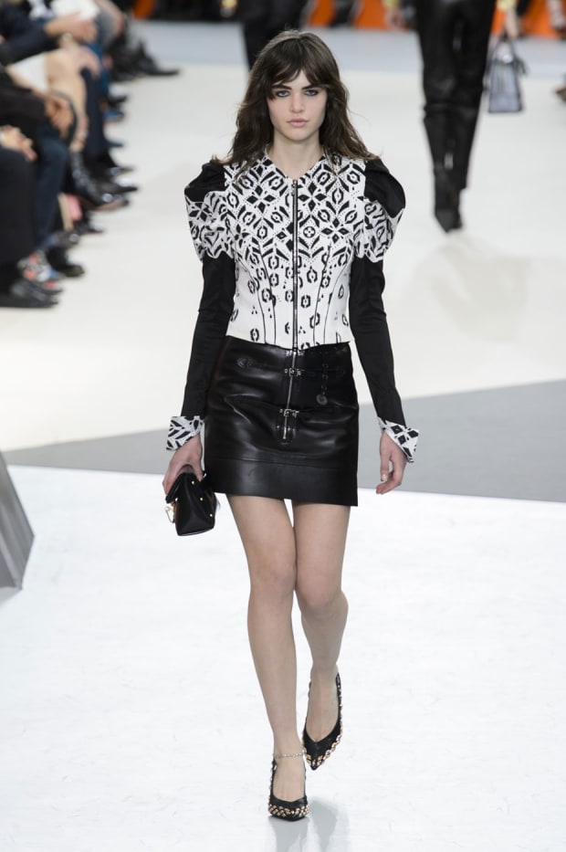 A model displays a creation by designer Nicolas Ghesquiere for Louis Vuitton  Fall-Winter 2014/2015 Ready-To-Wear collection show held at Cour Carree du  Louvre in Paris, France, on March 05, 2014. Photo by
