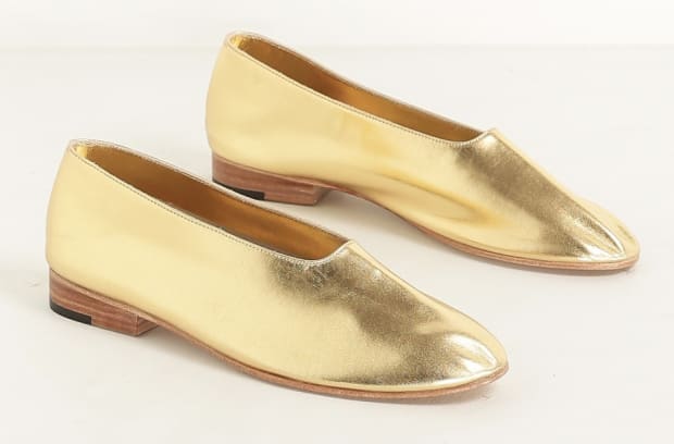 Martiniano gold leather glove flats, $414, available at Totokaelo.