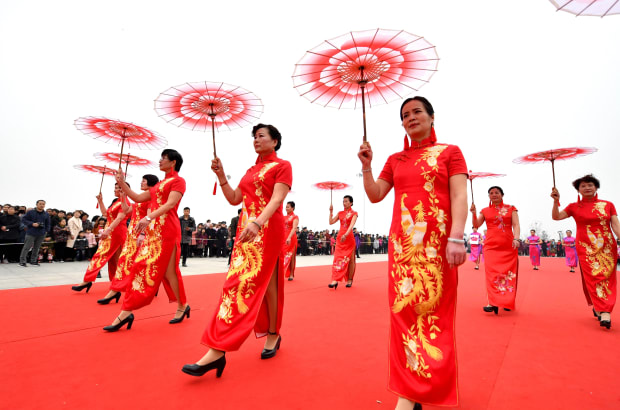 Women in Bozhou, within the Anhui province of China, wearing the traditional Chinese dress known as the qipao. Photo: VCG/VCG via Getty Images