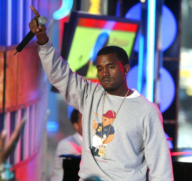 Rapper Kanye West wears a Polo Bear sweatshirt on stage during MTV's "Total Request Live" in 2004. Photo: Scott Gries/Getty Images