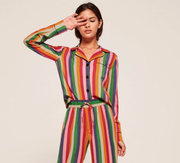 Reformation pajama set in rainbow stripe, $128, available at Reformation.