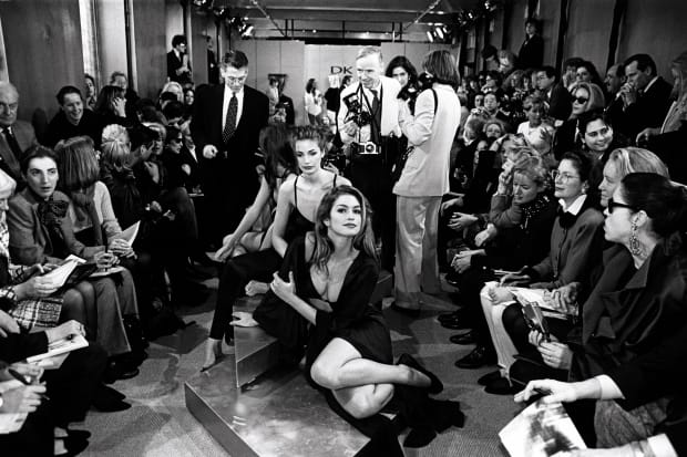Cindy Crawford reclines on the runway at Donna Karan's Fall 1992 show, April 1992. Photo: George Chinsee/Penske Media/REX/Shutterstock