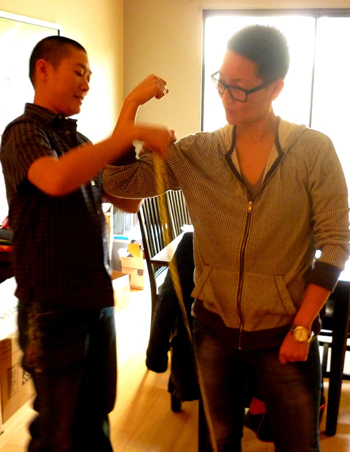 Sharpe Suiting founder and CEO Leon Wu takes measurements during a consultation. Photo: Sharpe Suiting