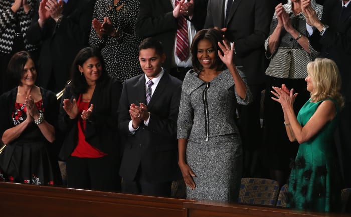 First Lady Michelle Obama waves during President Barack Obama's State of the Union speech. Photo: Mark Wilson/Getty Images
