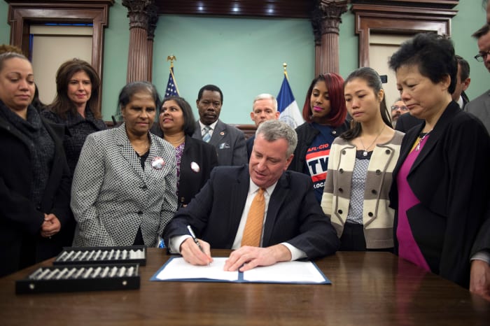 The major signing into law Intro No. 620, honoring Oscar de la Renta with a New York City street re-naming. Photo: Mayoral Photography Office