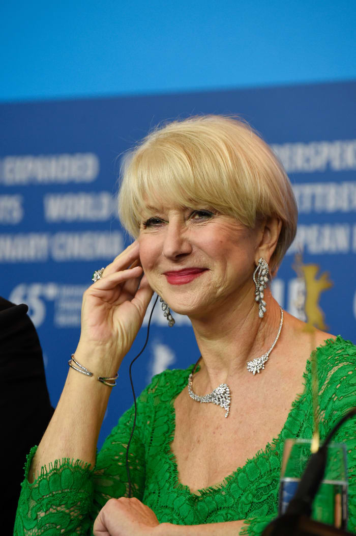 She's pretending to listen to something in a headset, but really she's just showing us her ring and bracelet. Photo: Pascal Le Segretain/Getty Images