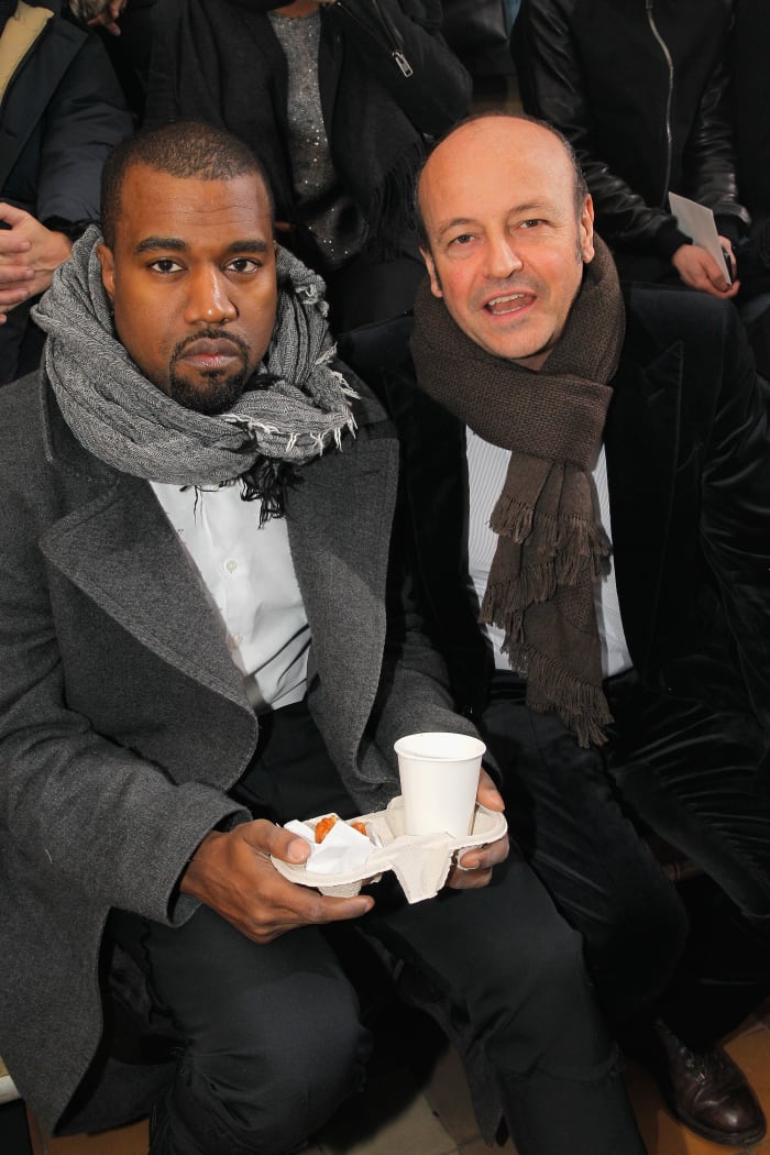 Thierry Andretta with Kanye West, having a snack front row at Lanvin in 2013. Photo: Bertrand Rindoff Petroff/Getty Images