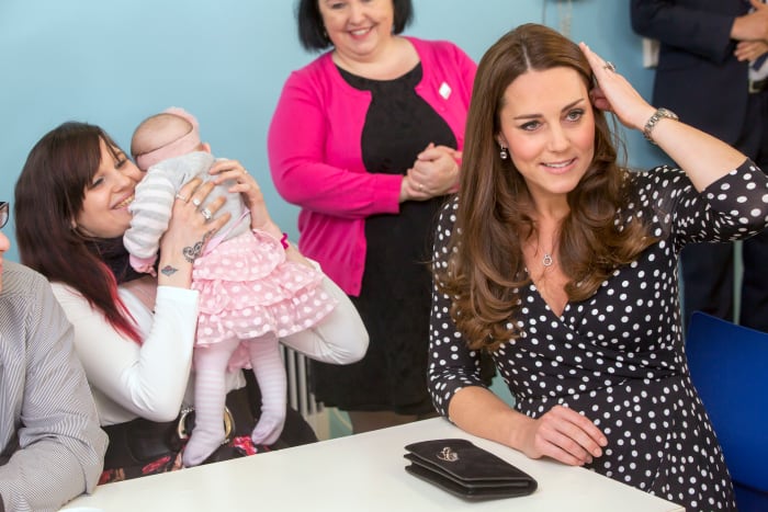 This is the face of a woman who just realized she'll soon double the number of children in her care. Photo: WPA Pool/Getty Images