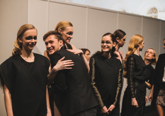 Saint-Tokyo designer Yriy Pitenin with models before his fall runway show. Photo: Mercedes Benz Fashion Week Russia