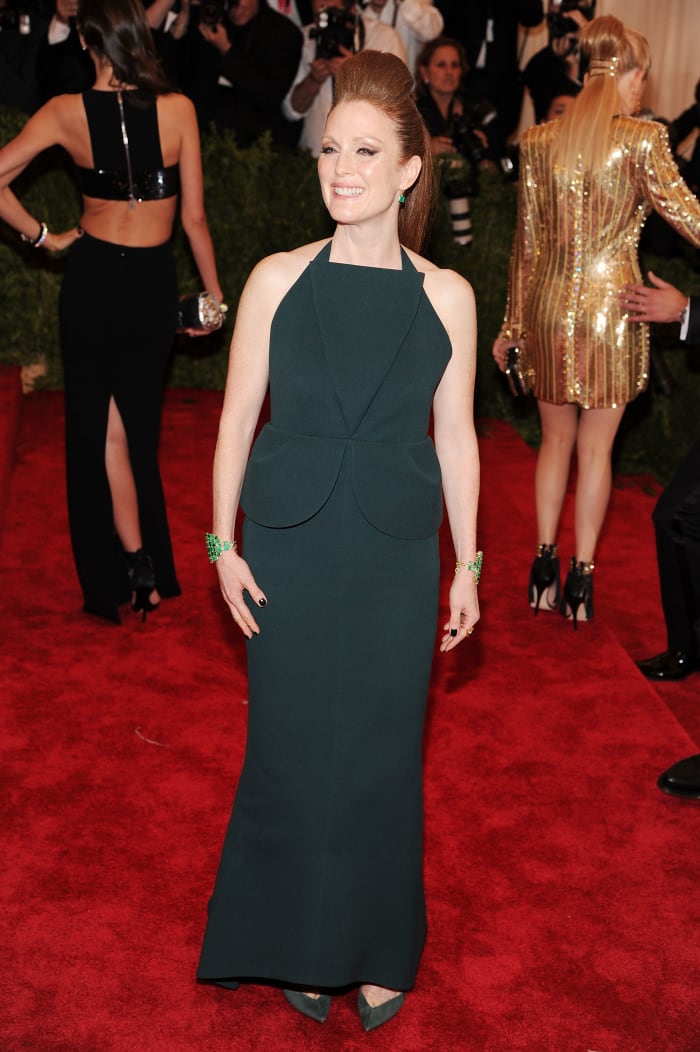 Julianne Moore at the Met Gala in 2013 wearing Irene Neuwirth's emerald cuffs. Photo: Jamie McCarthy/Getty Images