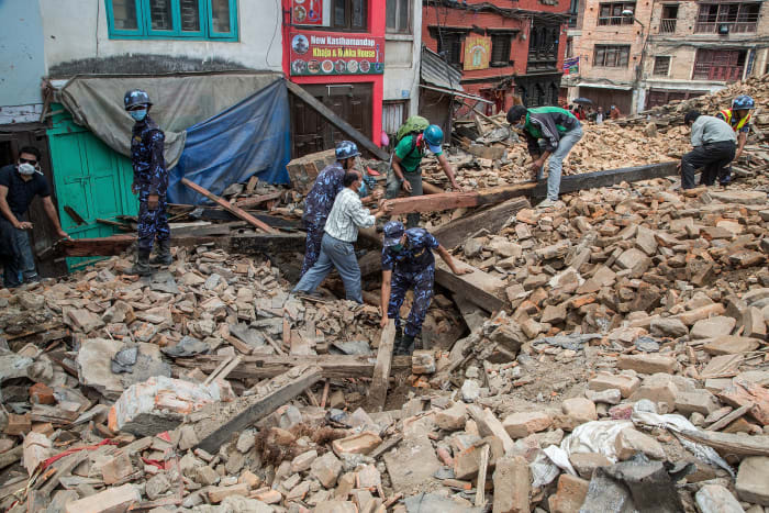Workers mine through the rubble following Saturday's earthquake in Nepal. Photo: Omar Havana/Getty Images