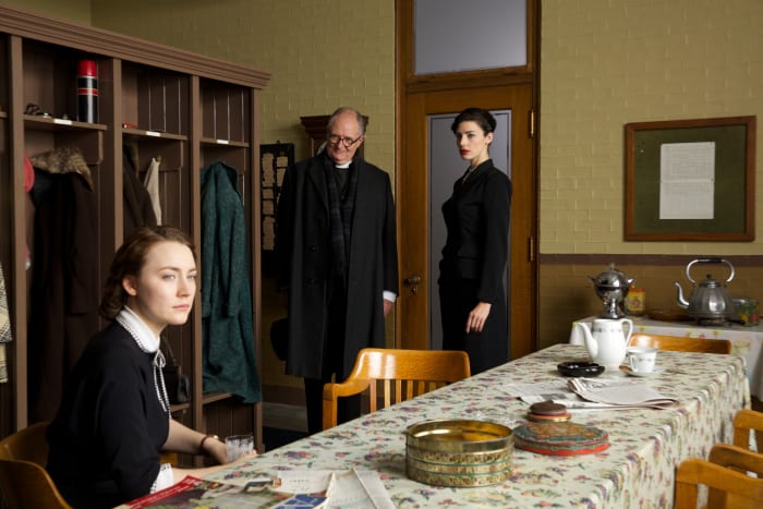 Jessica Paré as Miss Fortini looks on at her young employee. Photo: Kerry Brown/Twentieth Century Fox Film Corporation