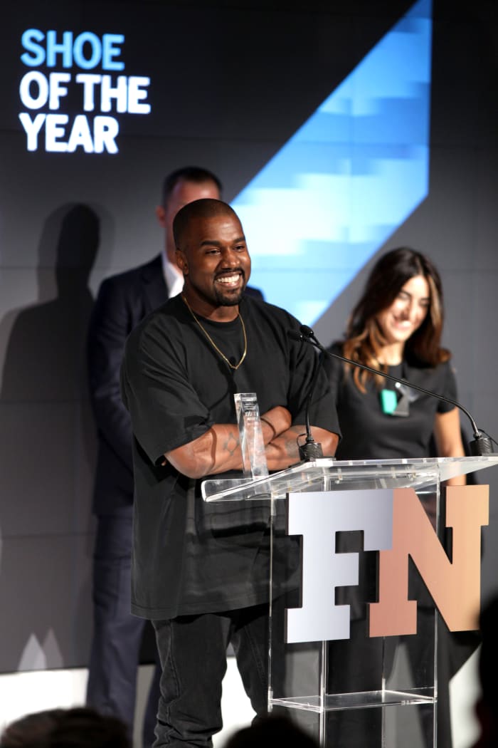 Kanye West accepts the award for "Shoe of the Year" at the 2015 Footwear News Achievement Awards, sponsored by Zappos Couture. Photo: REX/Shutterstock
