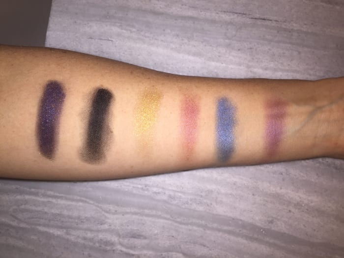 From L - R: Black gloss + pigment, black gloss alone/smudged out, Gold 002, Copper 002, Blue 002, Fuchsia 002. Photo: Cheryl Wischhover's ihone