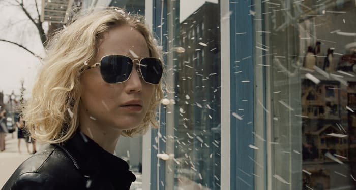 Jennifer Lawrence as Joy Mangano in her badass leather jacket and vintage aviators. Photo: Twentieth Century Fox