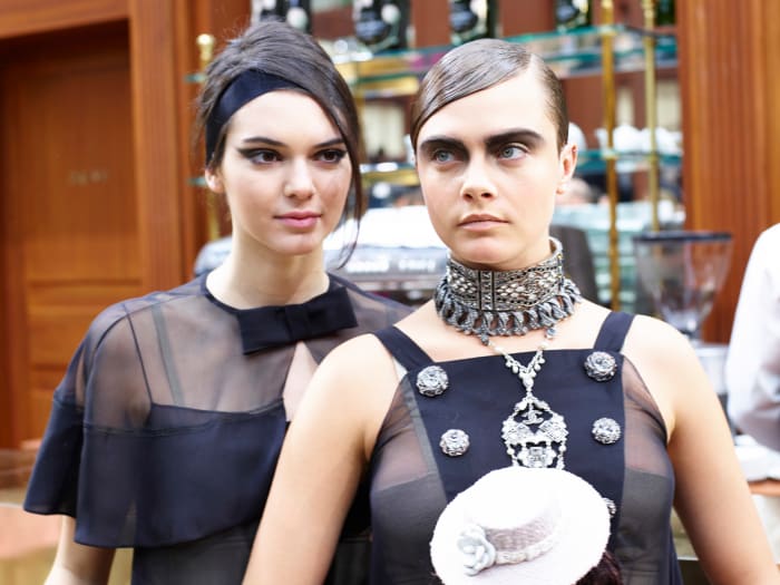 Kendall Jenner and Cara Delevingne at Chanel's fall 2015 show in March. Photo: Antonello Trio/Getty Images