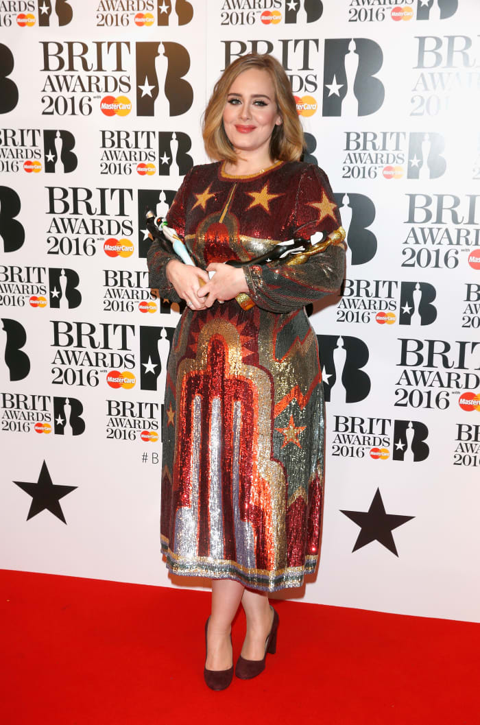 Adele toting her two statuettes in the winners room at the 2016 Brit Awards on Wednesday in London. Photo: Luca Teuchmann/Getty Images