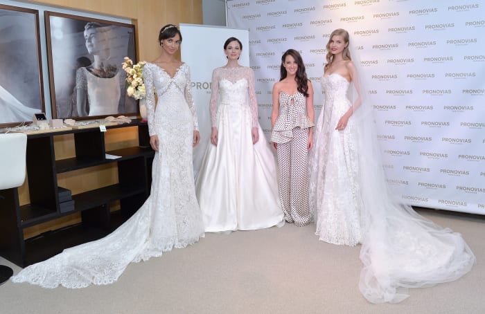 Stylist Micaela Erlanger with model brides at the Pronovias flagship boutique in New York. Photo: Pronovias