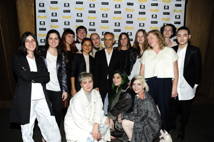 2015 Visionary Award recipient Francisco Costa with graduating seniors from Pratt Institute's Fashion Department. Photo: Patrick McMullan Company/Pratt Institute