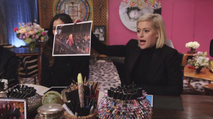 Cat sucking up big time. Also, keep an eye out for gems in the background of these shots. Screengrab: House of DVF