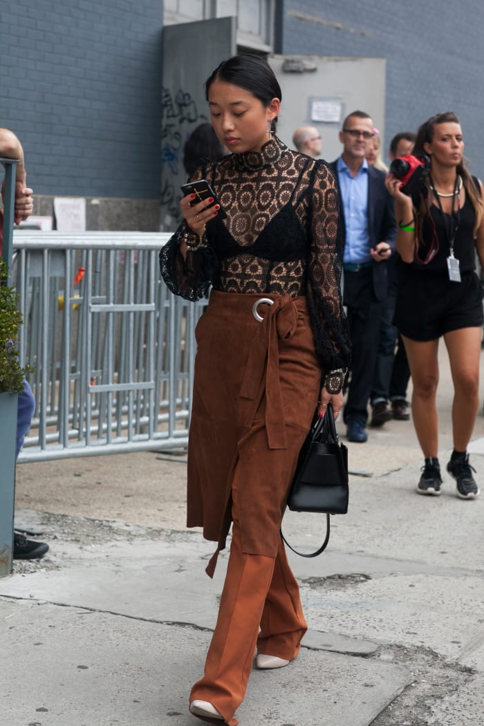Margaret Zhang in Zimmerman top, Tibi wrap skirt, C/MEO Collective pants and Boyy bag. Photo: Emily Malan/Fashionista
