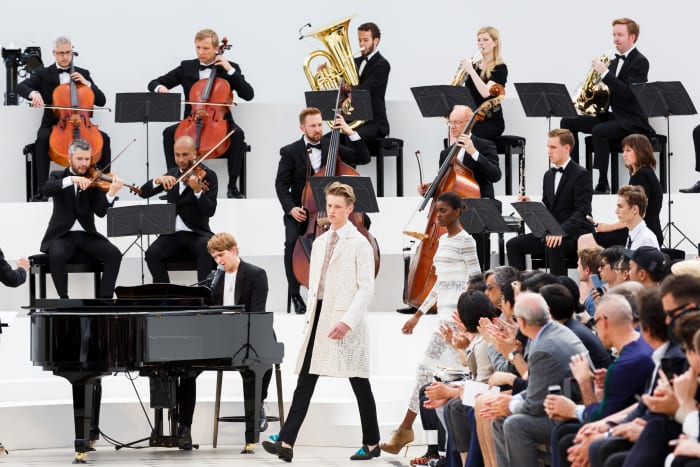 Burberry models walked the runway in front of a live orchestra at the brand's menswear show in June. Photo: Tristan Fewings/Getty Images