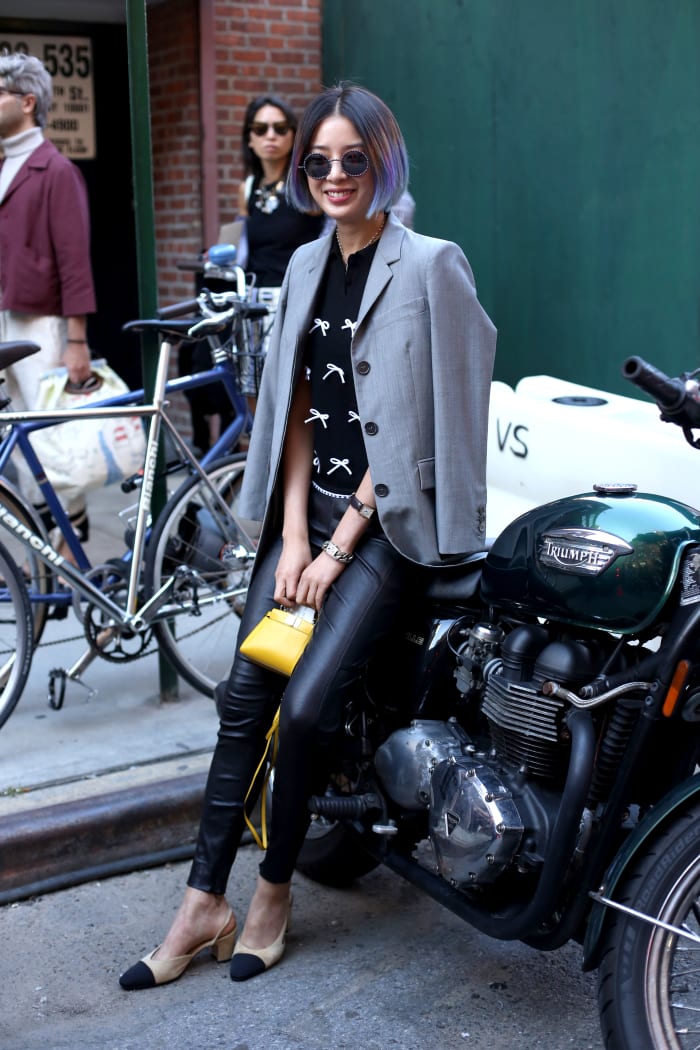 Model Irene Kim in Thom Browne jacket, Adam Selman top, Polo Ralph Lauren pants, Chanel slingbacks and Fendi bag. Photo: Angela Datre/Fashionista