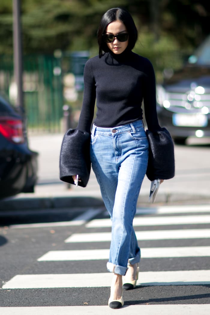 Blogger Yoyo Cao at Paris Fashion Week in a Celine top, Sandro jeans and Chanel slingbacks. Photo: Imaxtree