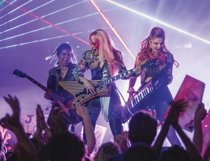 Aja (Hayley Kiyoko), Jem (Aubrey Peeples) and Kimber (Stefanie Scott) rock out. Photo: Justina Mintz/Universal Pictures