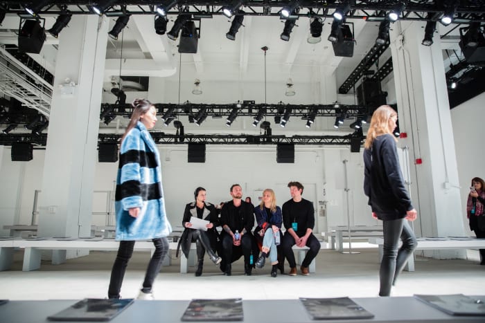 Laurie DeJong (seated, left) and her team run through the Marcel Ostertag fall 2016 NYFW runway show. Photo: LDJ Productions
