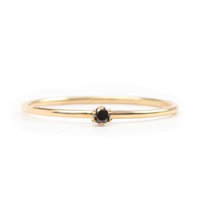 Satomi Kawakita The Tiniest Ring, Black Diamond, $210, available atundefinedCatbird.