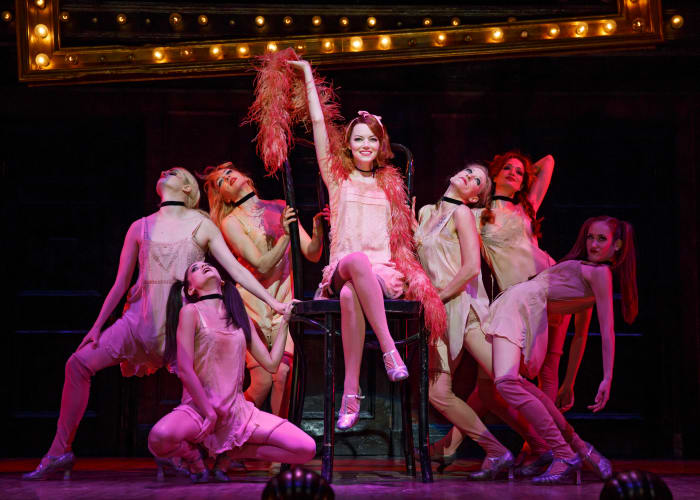 Emma Stone as Sally Bowles and company wearing costumes by William Ivey Long in 'Cabaret'. Photo: Joan Marcus