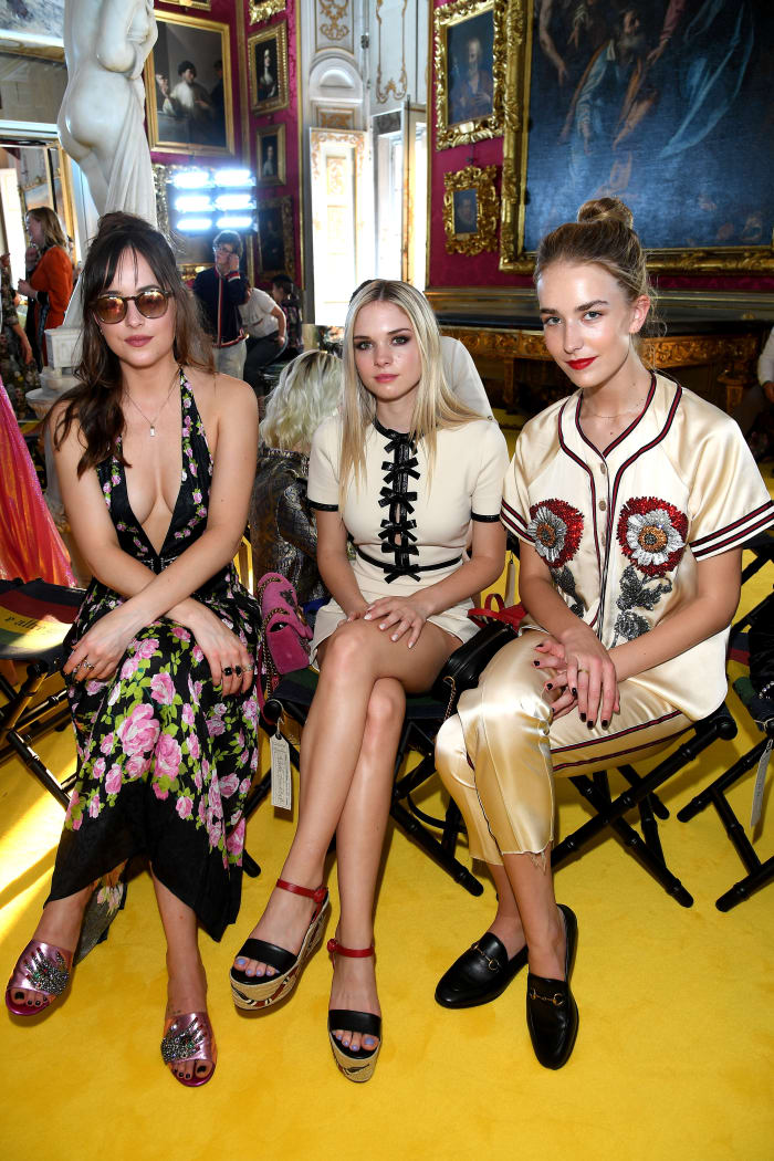 Dakota Johnson, Stella Banderas-Griffith and Grace Johnson at Gucci's Cruise 2018 show. Photo: Venturelli/Getty Images