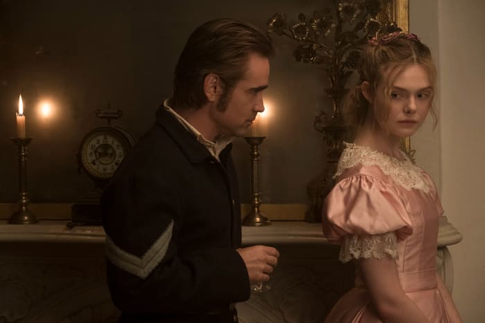 John (Colin Farrell) makes inappropriate eye contact with Alicia (Fanning). Photo: Ben Rothstein / Focus Features