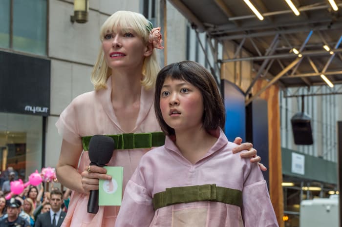 Lucy in custom Chanel and Mija (Ahn Seo-Hyun) in a coordinating outfit. Photo: Barry Wetcher/Netflix