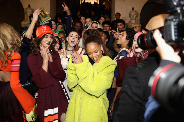Rihanna with models backstage before Fenty Puma's Fall 2017 runway show at Paris Fashion Week. Photo: Vittorio Zunino Celotto/Getty Images for Fenty Puma