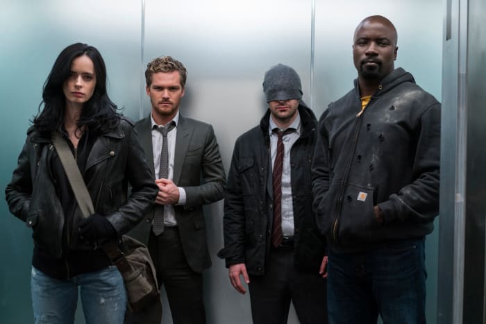 Jessica Jones (Krystin Ritter), Danny Rand/Iron Fist (Finn Jones), Matt Murdock/Daredevil (Charlie Cox) and Luke Cage (Mike Colter). Photo: Sarah Shatz/Netflix